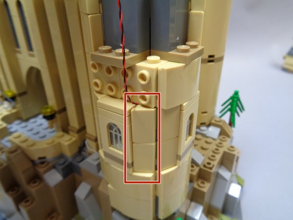 As shown by the red rectangle in the second photo, re-attach the side pieces next to the window.