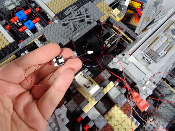 As shown in the second photo, you should also see a BRANCH03 adapter board and short black connecting cable from the old installation-- you can remove both of these as well.