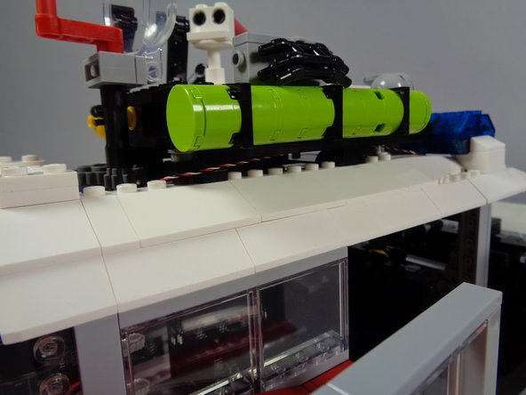 Make sure the wire is not close to any gears or parts that move.