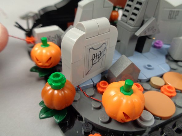 Continue running the light wire toward the back as shown in the third photo.