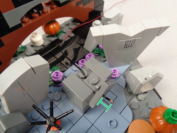 Re-attach Zero's nameplate, as shown in the second photo.