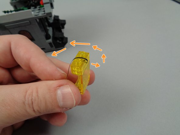 As shown by the orange arrows in the photo for this step, turn the window around and then carefully bend the LED light wires back over the top of the window.