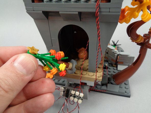 As shown in the first photo for this step, remove the Christmas tree.