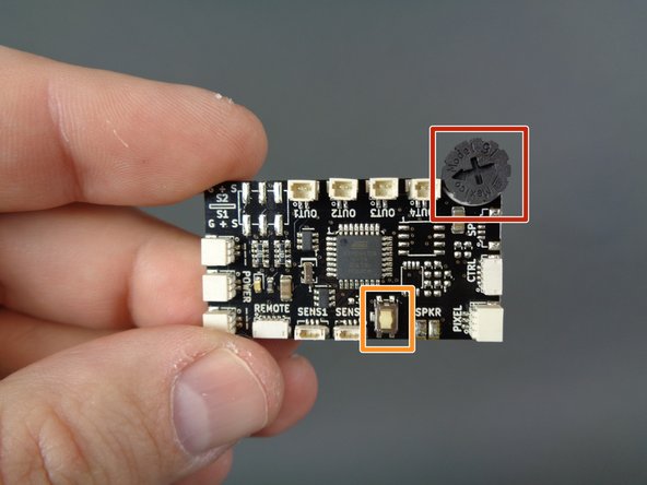 The photos in this step show both versions of the TRUNK08 master controller.  Refer to the photo that matches the specific version of TRUNK08 that was included with your kit.