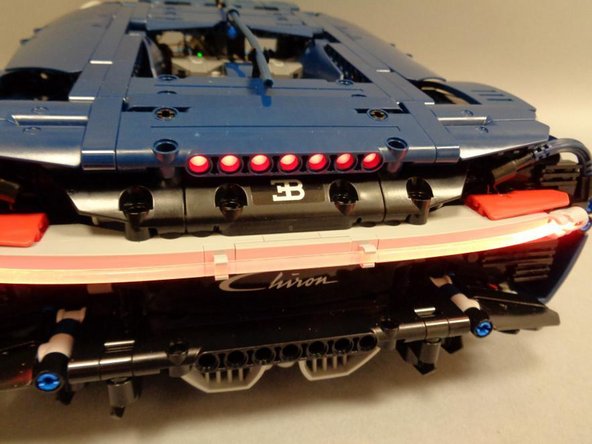 The pre-lit spoiler should still move up and down as freely as it did before you installed the LEDs.  Check to make sure you can still open and close the spoiler, and that it stays up when open.