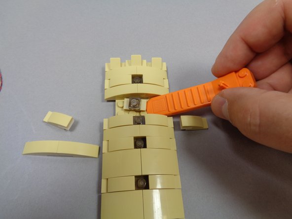 Your kit includes eight warm white lights pre-mounted inside tan 1x2 LEGO® jumper plates.  You can choose to mount these lights randomly in windows in any of the tower panels.