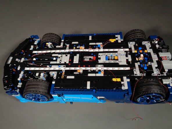 Repeat the process from the previous step to attach the second strip on the other side of the Bugatti frame.