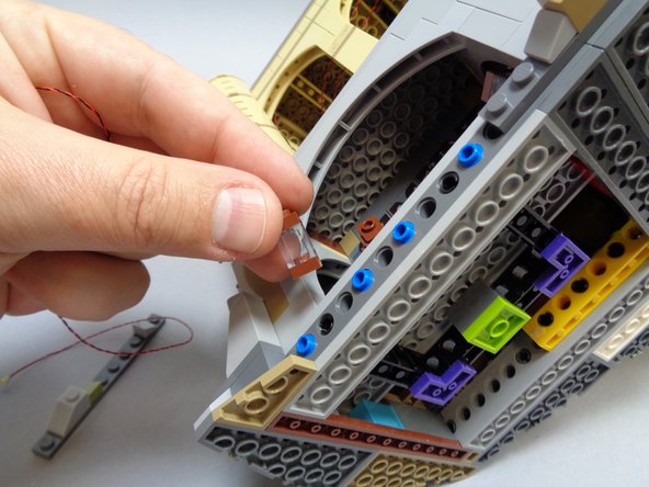 As shown in the second and third photos, remove the lantern and then the transparent brick that forms the lantern top.