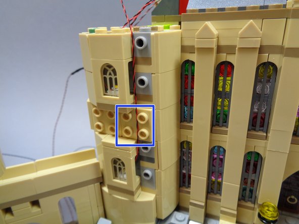 As shown by the blue square in the first photo, make sure the light wires for the lower window run between the studs of the plate above the window, not on top of the studs.