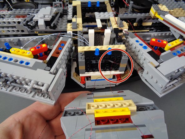 Now you will re-attach the right docking bay cap.