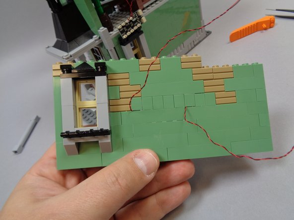 As shown in the third photo, you should now have the two sconce light wires coming out the back of the bedroom wall.