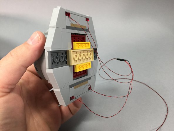 Now you will disconnect the 4-light docking bay LED assembly from its power plug, and connect it to the BRANCH13 adapter from the previous step.