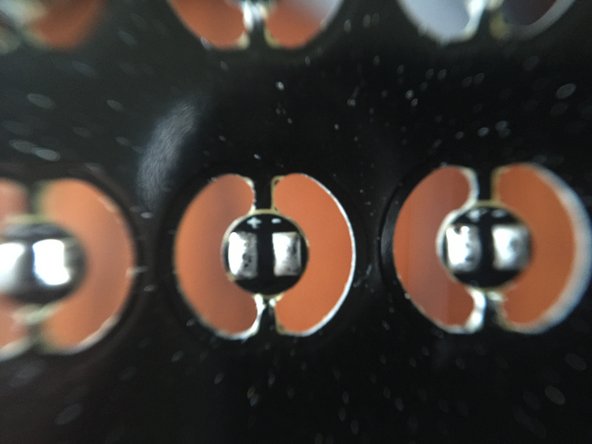 The solder should be in a lump over each pad-- this is critical for later steps, when you will solder wires to each pad (you will need to fully cover each wire lead with solder to hold it firmly in place).