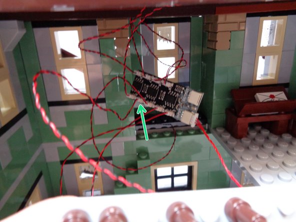 As shown by the green arrow in the third photo, connect the wire from the entryway warm white Pico LED light you mounted in Step 14 to the last open plug (#4) on the BRANCH09X adapter board.