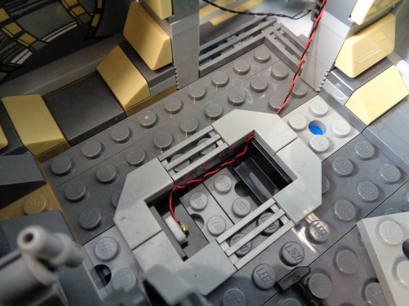 The photos in this step show one suggested way to mount the light-- you can mount it differently underneath the floor tile if desired.