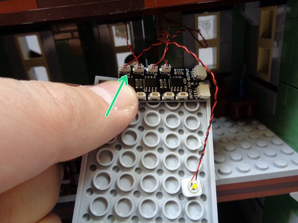 As shown by the green arrow in the third photo, connect the warm white Pico LED light wire to plug #6 on the BRANCH09X adapter board.