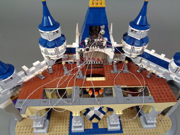 By this time you will have many light wires in the back of the castle-- as shown in the first photo, there will be a lot of excess wire.