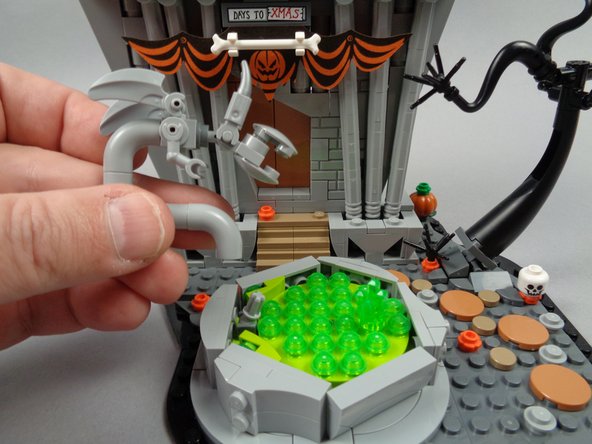 As shown in the first photo for this step, detach the monster statue from the fountain and set aside.
