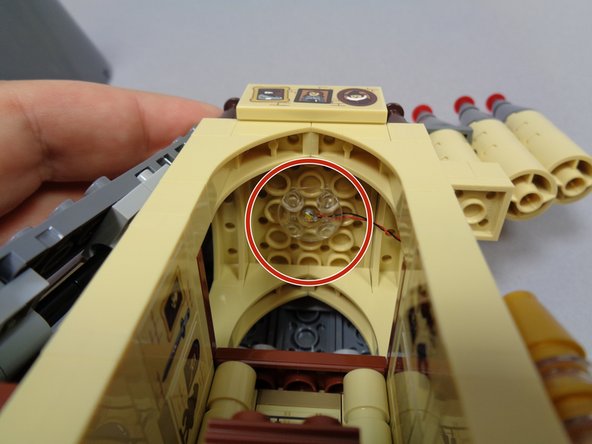 As shown in the first photo, take the third light and clear &quot;boat stud&quot; part from Bag 8 and mount the light on the ceiling of Dumbledore's office.