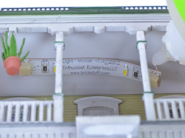 If a light strip pulls away from its mounting over time, it can be re-attached using double-sided tape or a small amount of glue appropriate for the material the strip is mounted to.