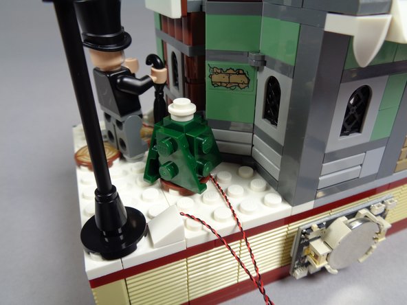 As shown in the first and second photos-- and especially by the orange arrows in the second photo-- position the light wires for the lamp post and lantern so they pass toward the back and that they pass between, not on top of, studs.