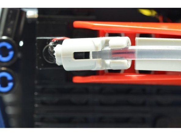 Snap the clear fiber optic tube into place on the rear of the car.