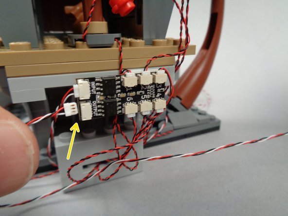 As shown in the third photo for this step, make sure all three sections of your lighting setup are connected to prepare for Test #4.
