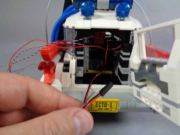 As shown in the first photo for this step, gather up all four wires coming from the roof: