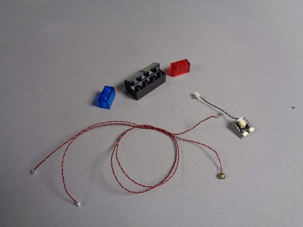 As shown in the third photo, remove the transparent red and blue bricks from the computer panel, then remove the two Pico LEDs from under the bricks.  You can use these two Pico LEDs, plus the BRANCH03 adapter and short black cable, for another lighting project.