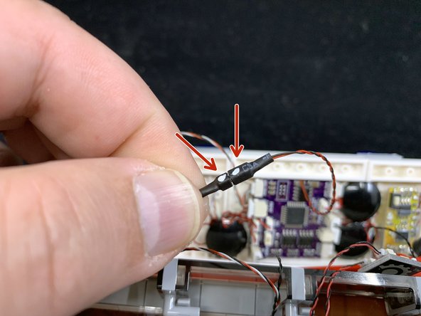 The photo shows the main power wire connected to the front plug and the tail lights connected to the rear plug, but you can connect either wire to either plug.