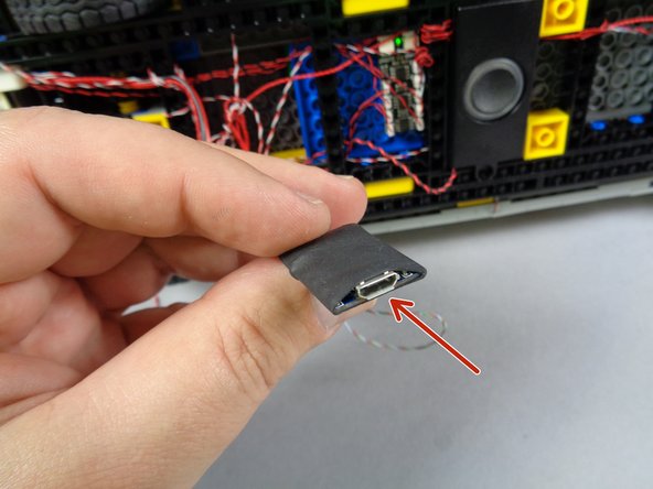 The blue square in the second photo shows where the sound module's power/control wire should be connected: to the smaller plug under the SOUND MODULE label on the main controller.