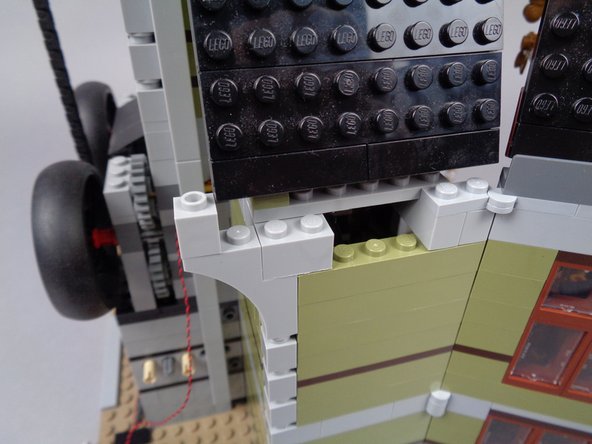 Remove the 1x3 brick as shown in the photos.