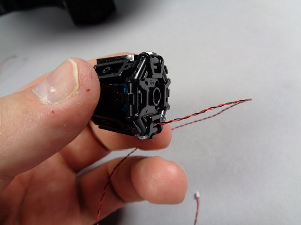 The second photo shows how the light wire should pass out the back of the engine.