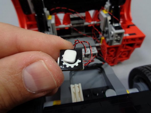 As shown in the third photo, put a small sticky square on the back of the BRANCH03 adapter board for mounting in the next step.