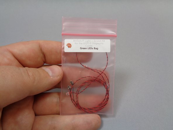 Remove the &quot;Green LEDs Bag&quot; from Bag 1, and remove one of the green lights from the bag.