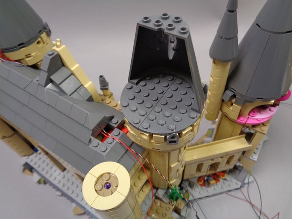 Now you will repeat the same steps you used on the first tower to add three warm white window lights to the second tower.  Begin by disassembling the top of the tower as shown in the photos.