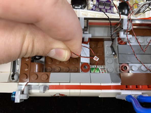 As shown in the first photo, run the searchlight wires along the edge of the top of the door, making sure the wires run next to the studs, not on top of them.