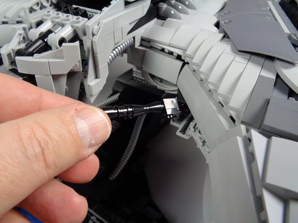 Next you will remove the two front guns as shown in the first two photos for this step.