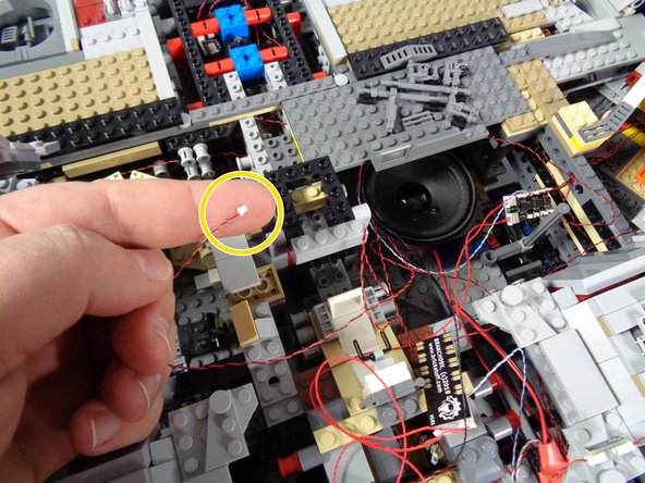 As shown by the yellow circles in the first and second photos, disconnect these two light wires.  The arrow in the first photo points to the BRANCH15 adapter board from which you will disconnect the two plugs.