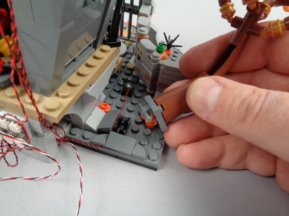 As shown in the third photo for this step, remove the tree to continue routing the 3-wire cable.