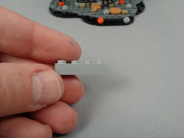 The photos for this step show how to use the five Light Bluish Gray parts from your &quot;Brick Parts&quot; bag to construct a support base for the wires.