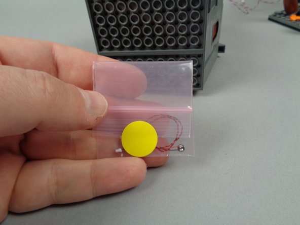 Next, you will mount the yellow LED light above the door to Jack's house.