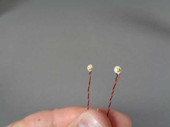 There are warm white Pico LED lights with several different length wires in the bag.  Remove the two LED lights with 12&quot;/30.4cm wires as shown in the second photo.