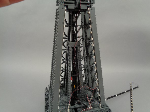 Leave the top LED strip section (the 20-LED strip) hanging loose for now as shown in the second photo).