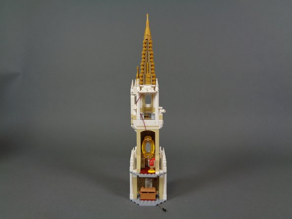 Once re-assembled, your setup should look like the second photo.  The short wire with the black connecting plug should extend below the lower floor of the tower and all parts should be replaced.