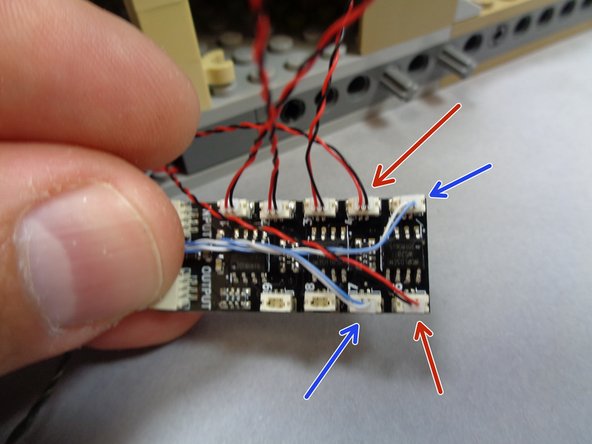 As shown by the blue arrows in the third photo, connect the blue and white flame wires to plugs #5 and #7 on the BRANCH09X adapter board.
