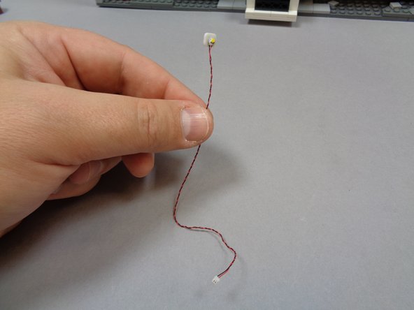 Take one of the warm white Pico LED lights with 6&quot; (15.2cm) wire and attach a small sticky square to the back as shown in the second photo.