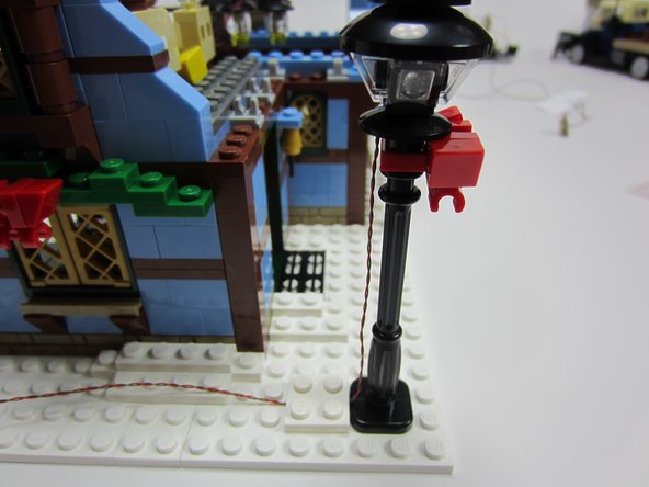 Light the cottage's front lamp post