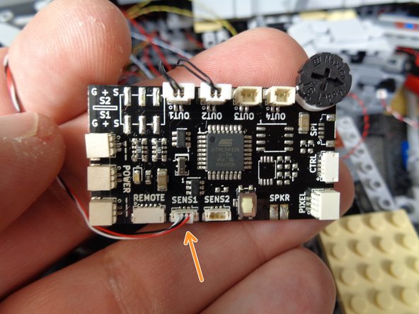 The two photos in this step show where to connect the 3-wire control cable to the TRUNK08 master controller.