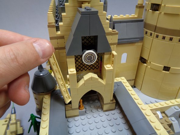 Although this looks like major disassembly, the sections of the clock tower can be removed while keeping large sections intact.  Follow the steps in the photos, and it's always a good idea to have your original LEGO instruction book handy in case you forget where a piece goes during re-assembly.
